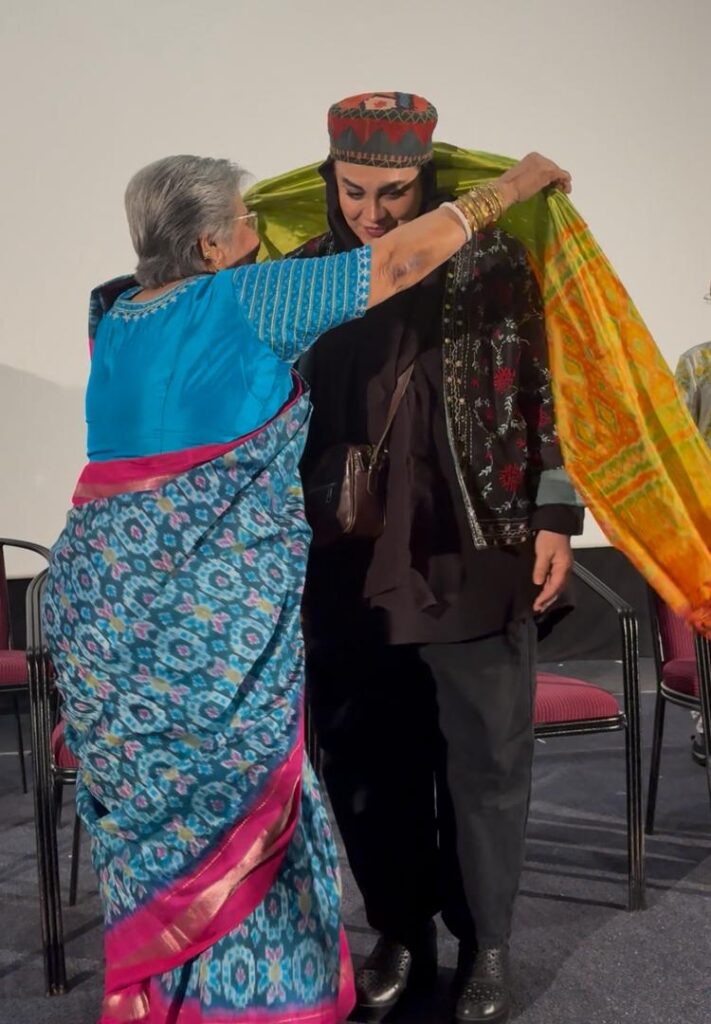 Iranian filmmaker Narges Abyar being felicitated with a shawl at the Hyderabad film festival.