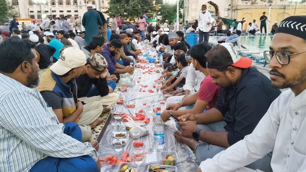 Community gathering for Iftaari at Makkah Masjid during Ramadan.