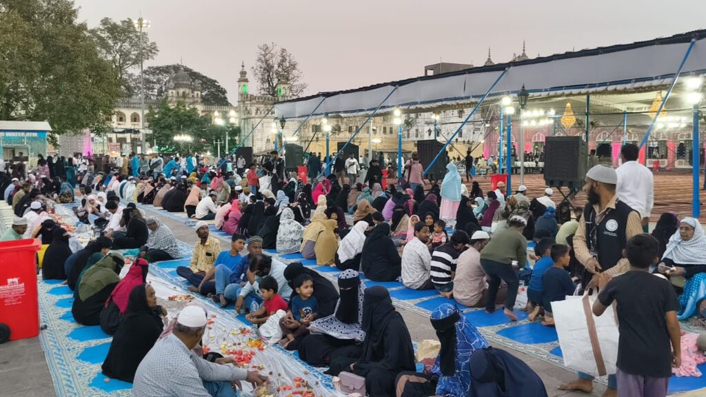 Iftaari gathering at Makkah Masjid with community members breaking fast together.