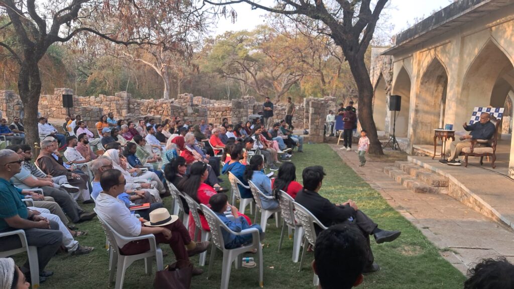 An audience watching a traditional event outdoors in the Deccan's cultural heart.