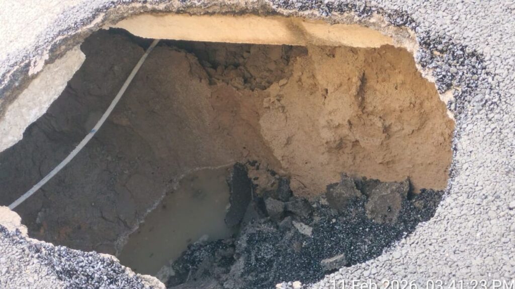 Pothole on Malakpet Road in Hyderabad causing traffic issues and safety concerns.