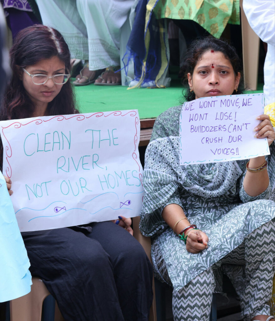 South Africa cricket player in yellow and green uniform on the field, holding a ball, with a blurred stad.