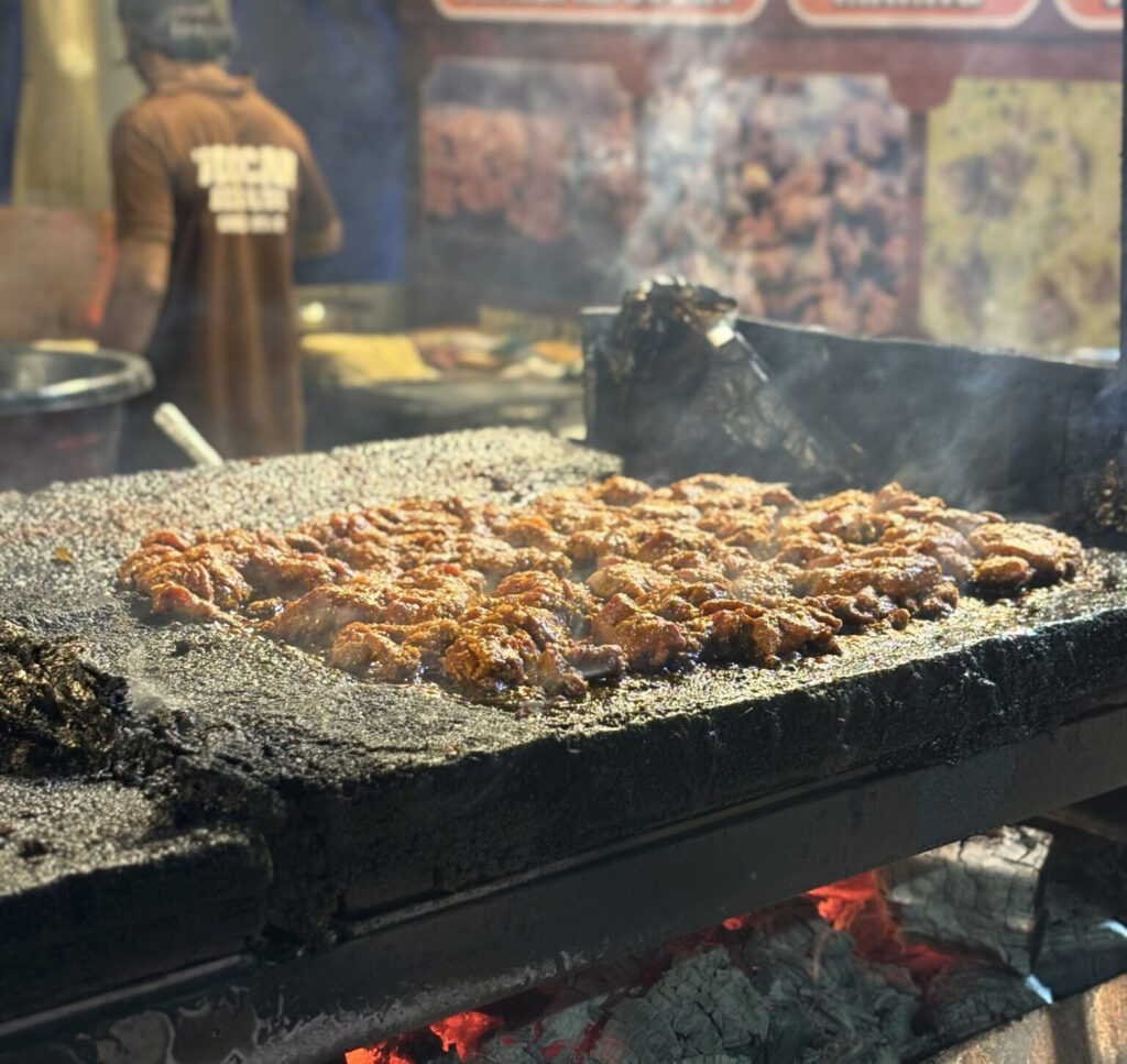 Cricket player wearing South Africa team jersey on the field during a match.