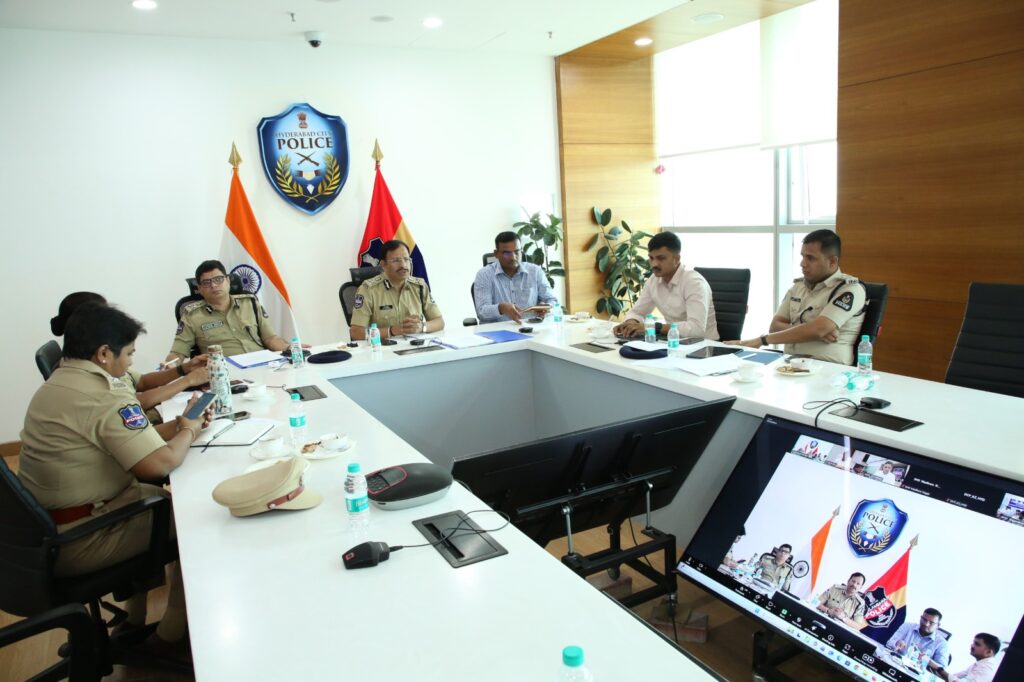 Police officials in a meeting discussing security strategies in a modern conference room.