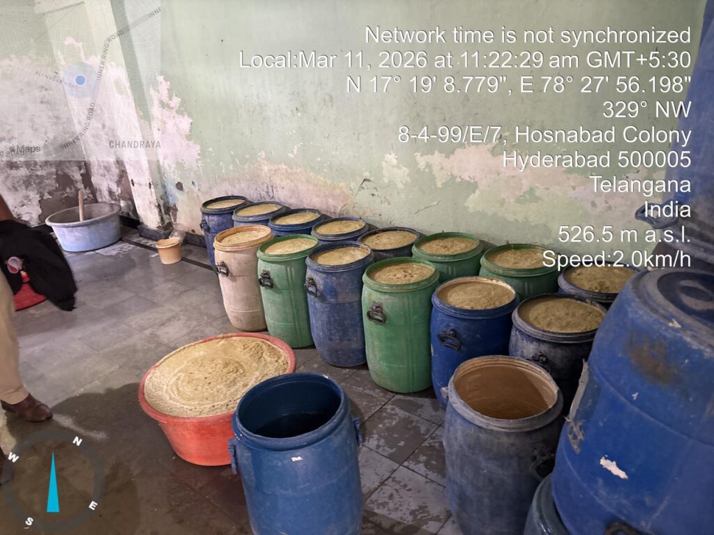 Ginger paste stored in various coloured barrels in Hyderabad, India, related to food safety concerns.