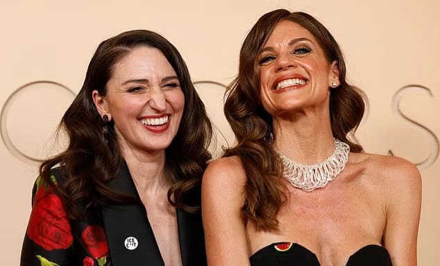 Singer-songwriter Sara Bareilles wearing an ‘ICE OUT’ pin on the Oscars 2026 red carpet.