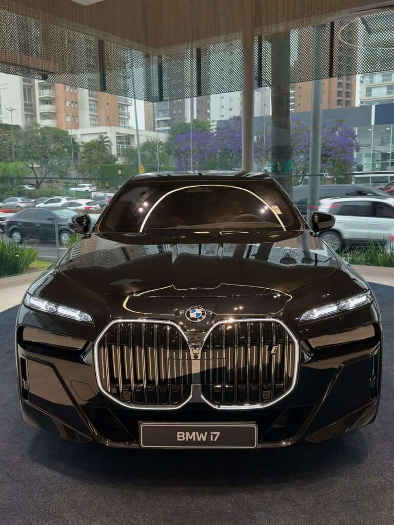 Elegant black BMW i7 with distinctive grille and sleek design, part of Kavya Maran’s Rs 25 crore car coll.