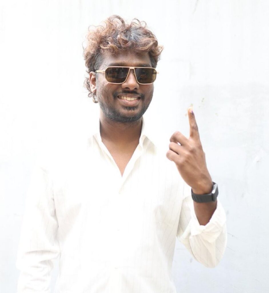 Man with sunglasses showing his finger after voting in Tamil Nadu elections 2026.