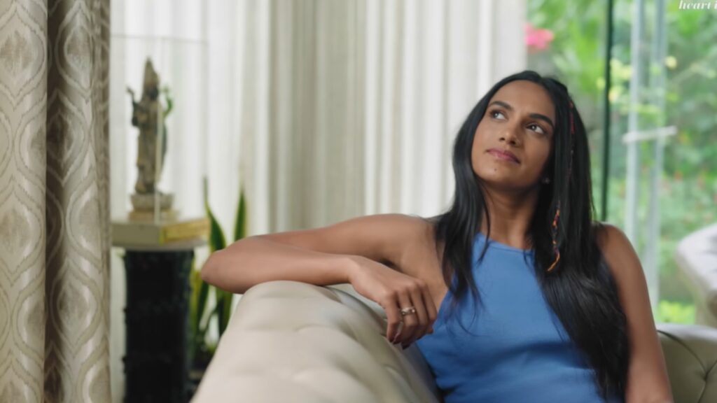 PV Sindhu relaxing in her lavish Hyderabad hilltop home with modern decor and scenic views.