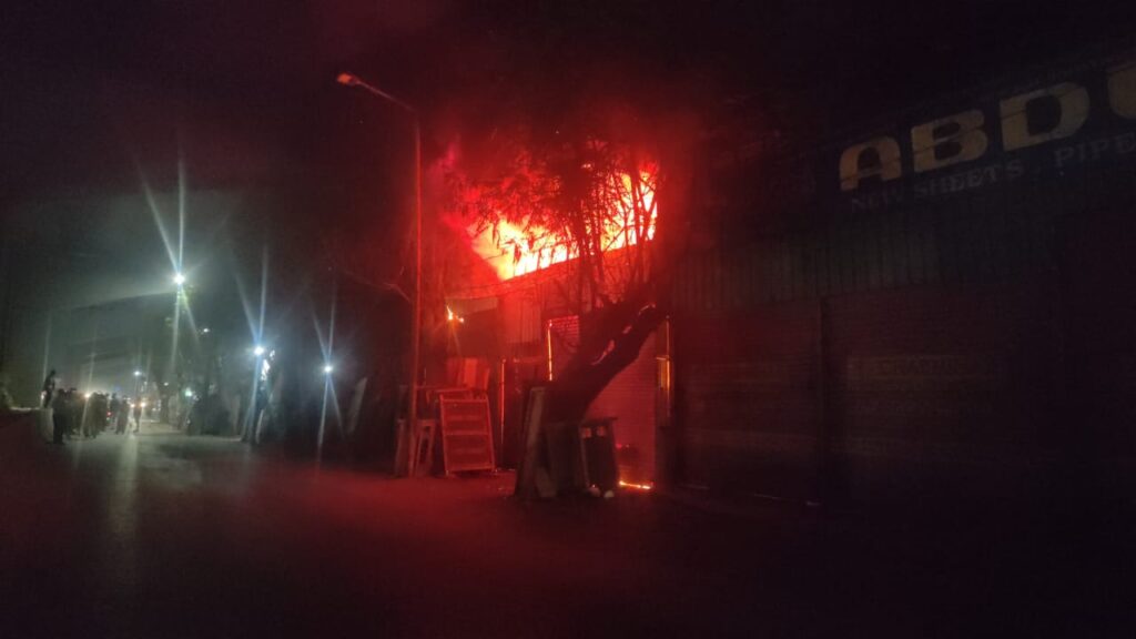 Massive fire at Bahadurpura scrap yard near Hyderabad zoo caused by heat, with flames and smoke visible a.
